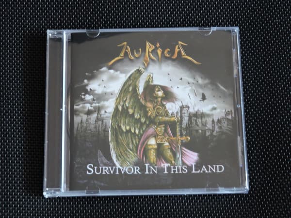 Aurica — Survivor In This Land