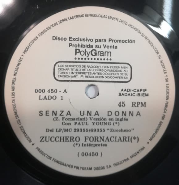 Zucchero Fornaciari & Paul Young & Zucchero Fornaciari & Eric Clapton — Senza Una Donna / Un Meravilloso Mundo = A Wonderful World