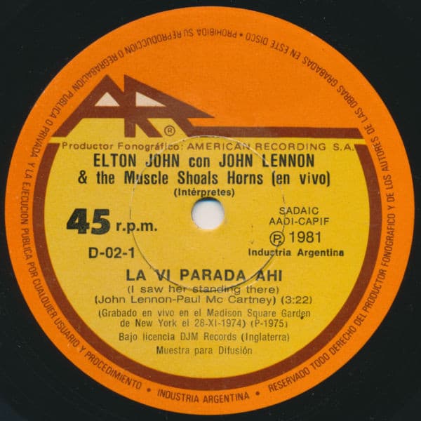 Elton John & John Lennon — La Vi Parada Ahi (I Saw Her Standing There) / Cualquier Aventura Nocturna (Whatever Gets You Through The Night)