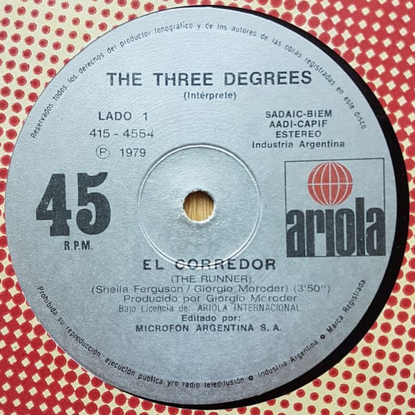 The Three Degrees — El Corredor (The Runner) / Otra Vez Sin Amor (Out Of Love Again)