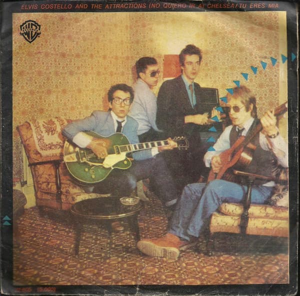 Elvis Costello And The Attractions — (No Quiero Ir a) Chelssea = (I Don't Want To Go To) Chelsea